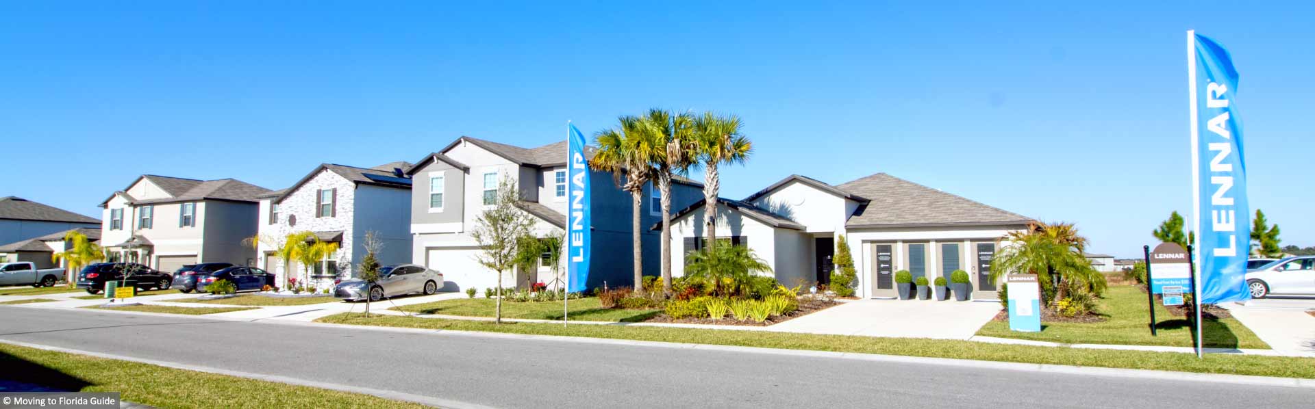 two story homes with landscaping and blue sky