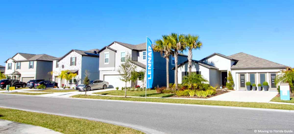 new Florida homes with palm trees on a sunny day