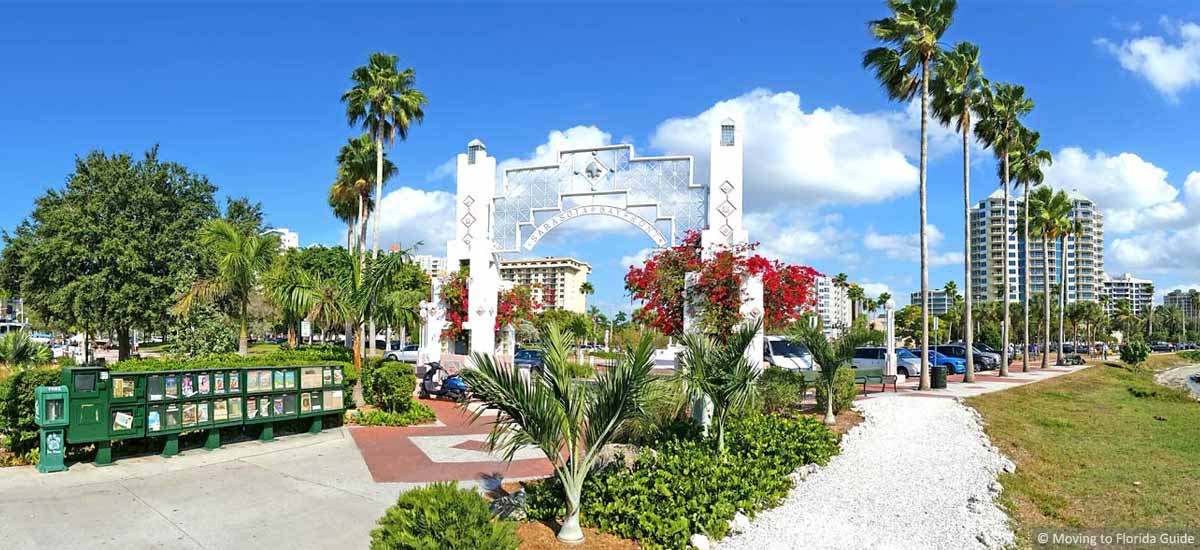 large archway and Florida palm trees with blue sky