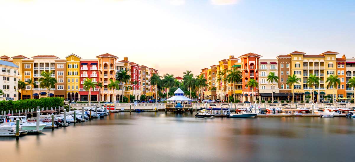 colorful condos in naples overlooking waterfront marina